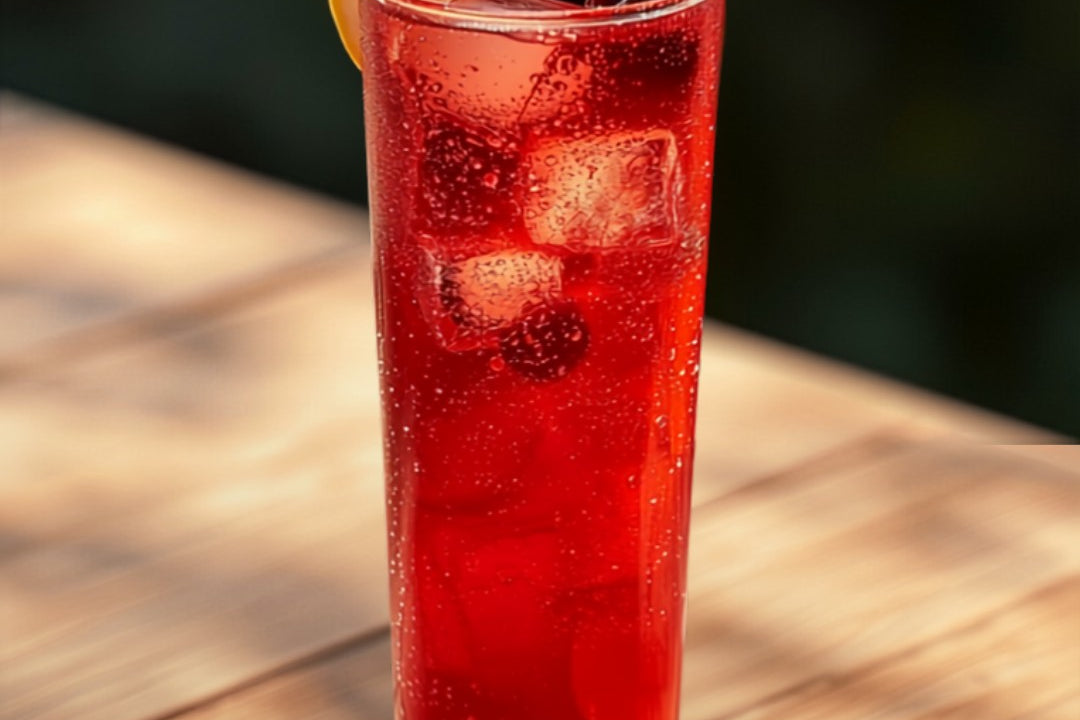 Ruby-red hibiscus iced herbal tea over ice